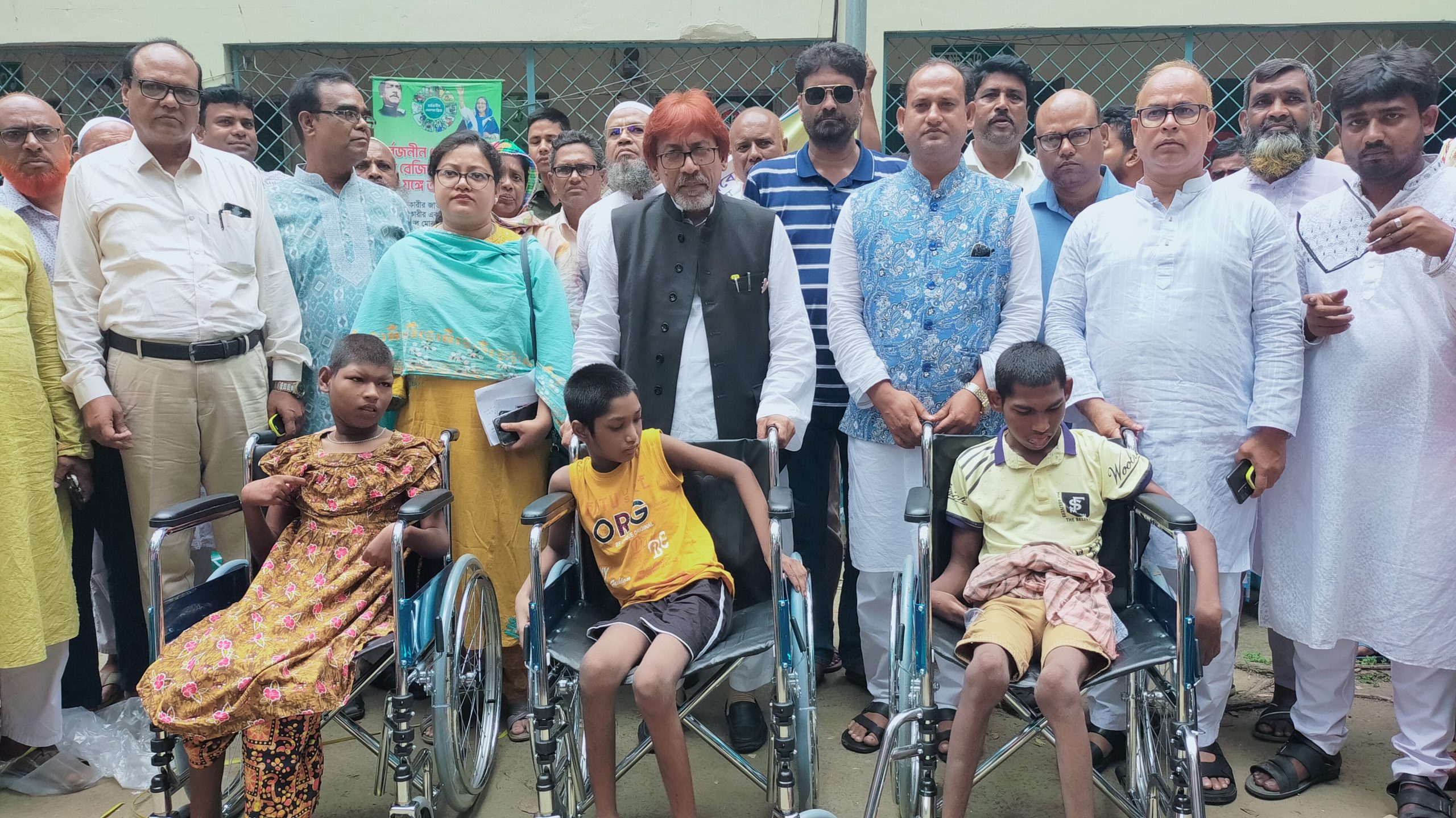 গুরুদাসপুরে হুইল চেয়ার,সেলাই মেশিন,চেক ও কৃষি উপকরণ বিতরণ